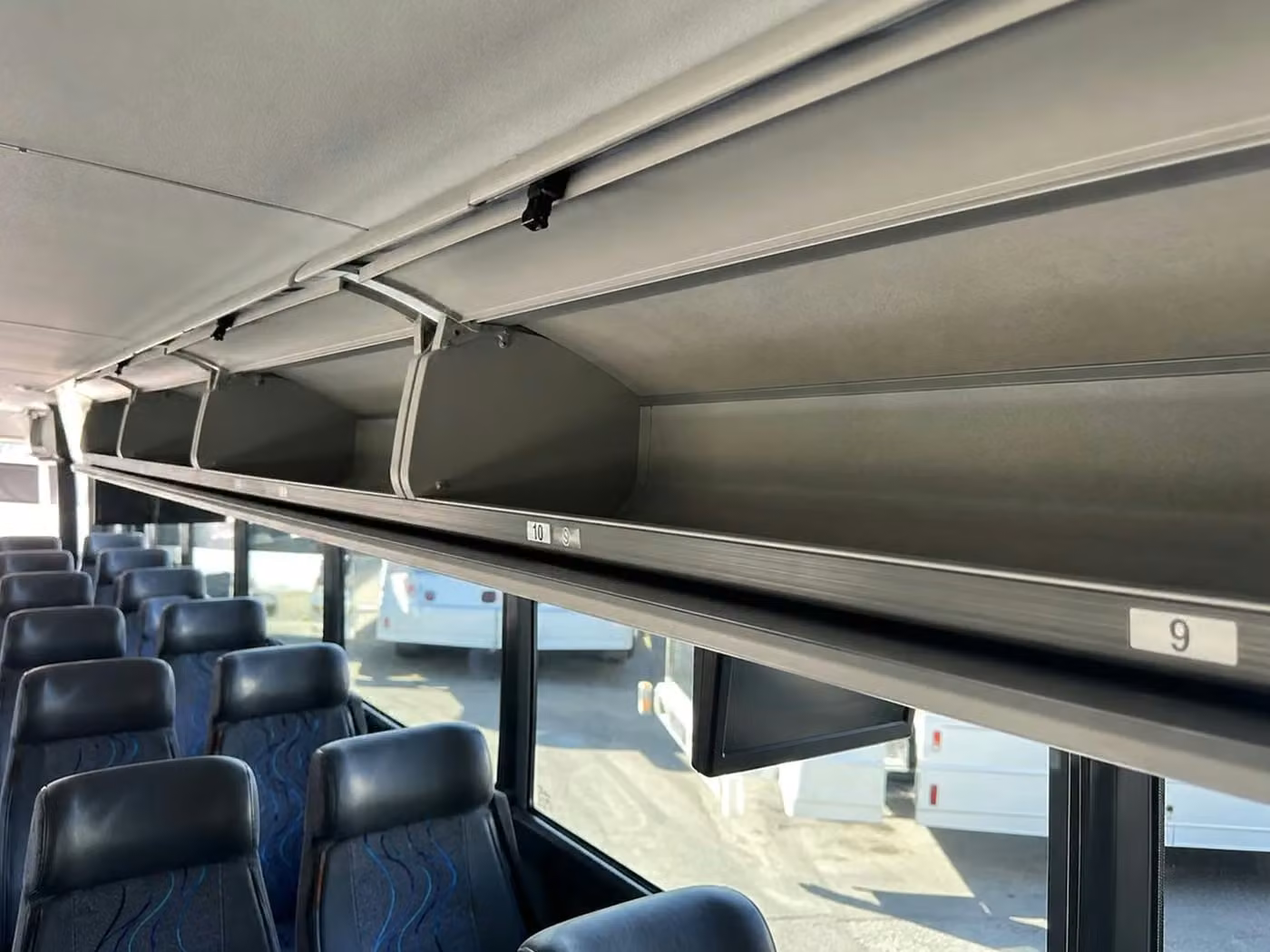 daphne 25 passenger minibus overhead storage