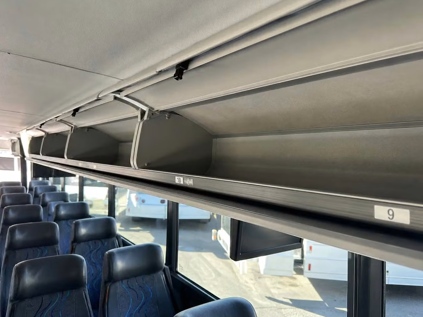 daphne 56 passenger charter bus overhead storage